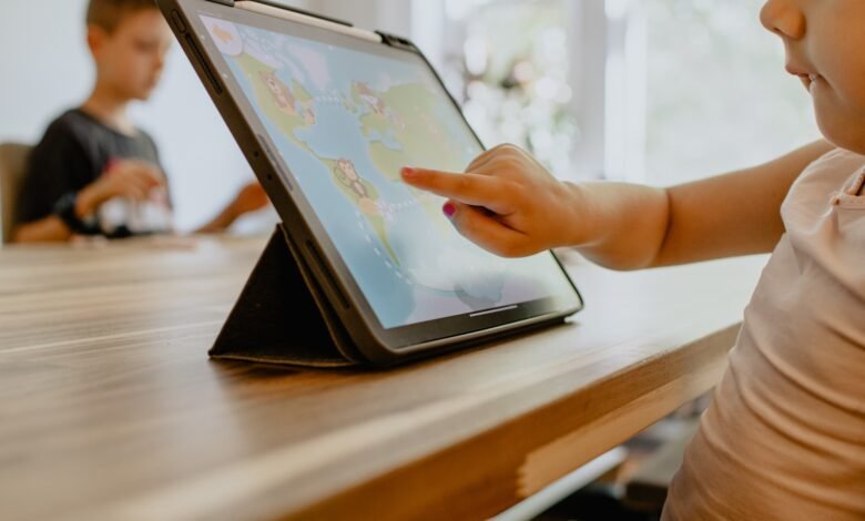 person using white tablet computer